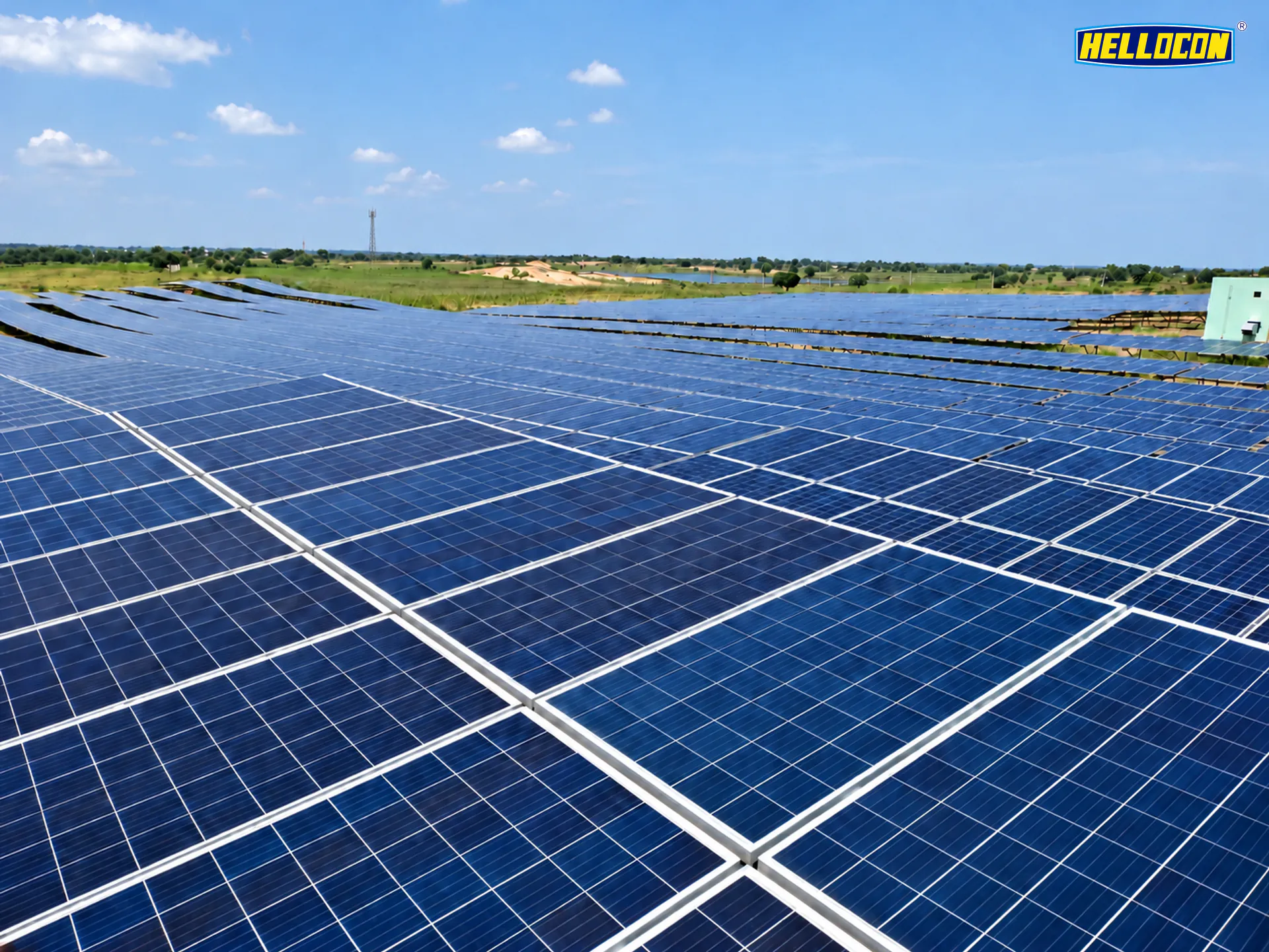 Close view across the panel rows of the HELLOCON 500 kWp ground-mounted solar plant in Keonjhar
